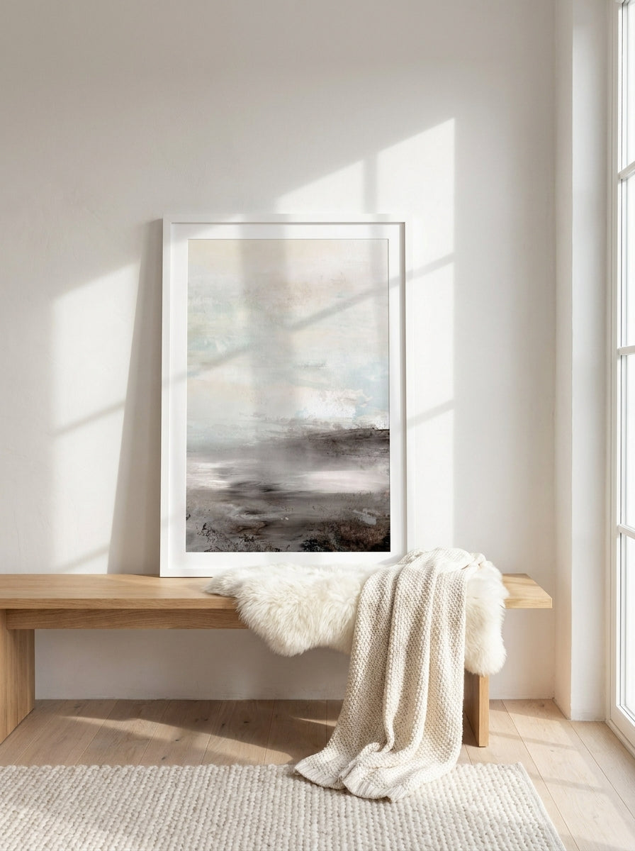 Modern wall art print standing on a bench in a bright Scandinavian home office