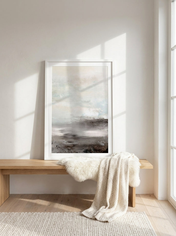 Modern wall art print standing on a bench in a bright Scandinavian home office