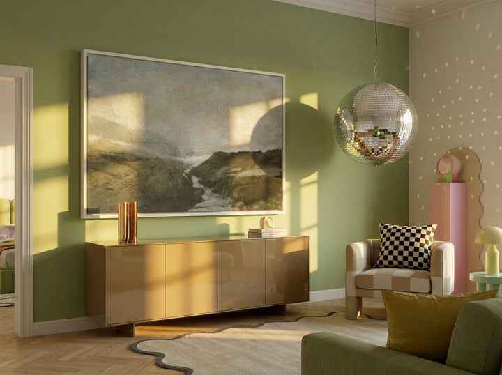 Oversized statement canvas wall art with a white surround styled on the wall in a colourful eclectic living room