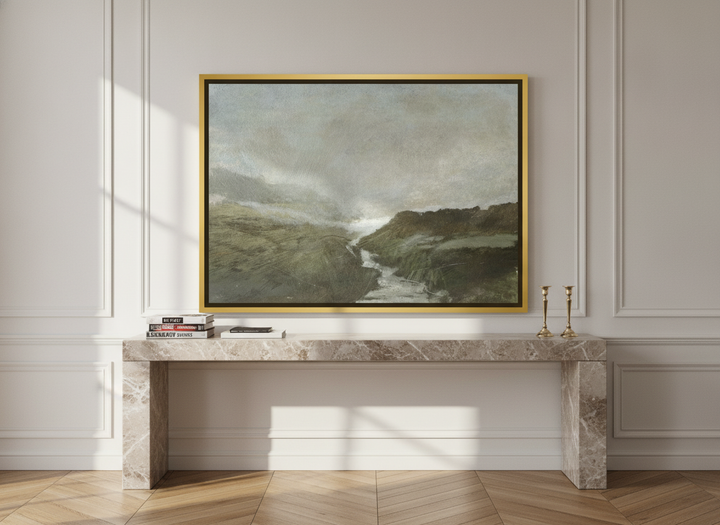 Canvas wall art with a gold leaf surround standing on a console in a Parisian bedroom