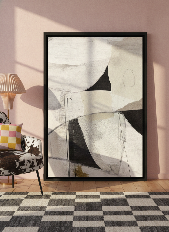 Canvas wall art with a black surround leaning against the wall in a colourful eclectic living room