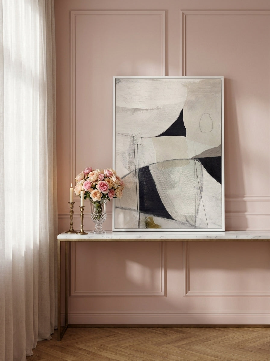 Modern wall art print standing on a console in a Parisian home office