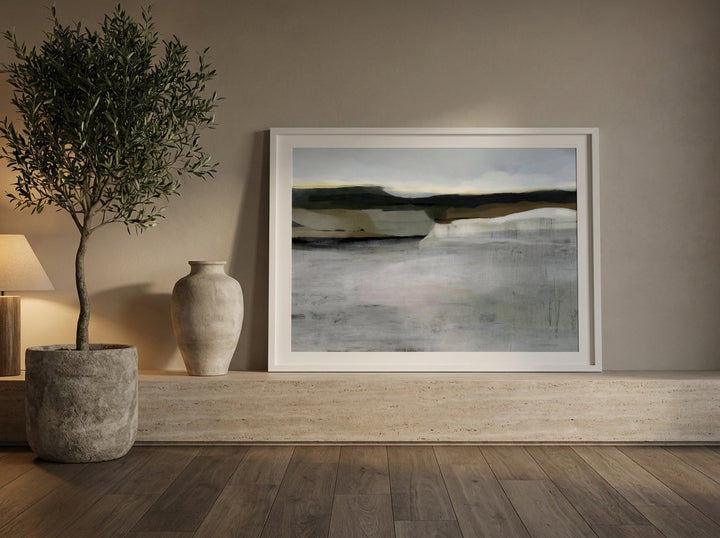 Modern wall art print standing on a console in a luxe bedroom