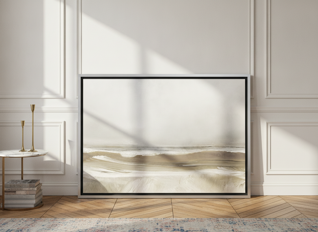 Canvas wall art with a silver leaf surround leaning against the wall in a Parisian bedroom