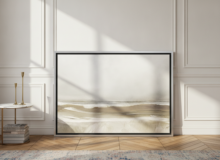 Canvas wall art with a silver leaf surround leaning against the wall in a Parisian bedroom