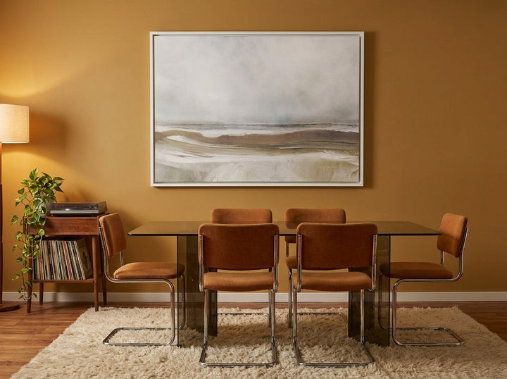 Oversized statement canvas wall art with a white surround styled on the wall in a retro 70s dining room