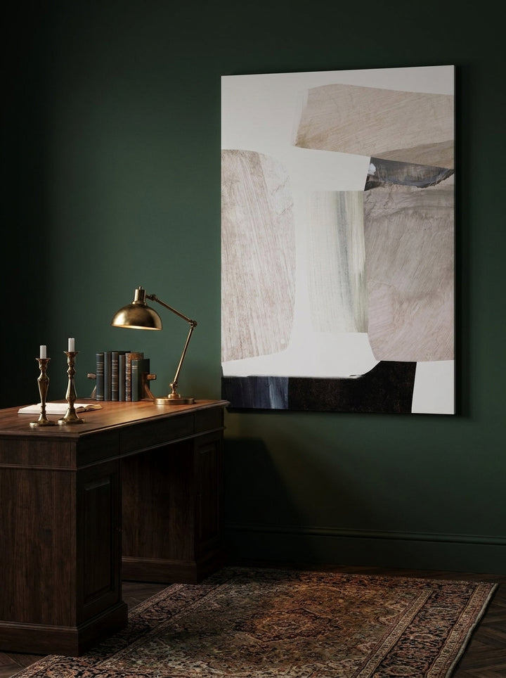 Stretched canvas wall art styled on the wall in a moody home office