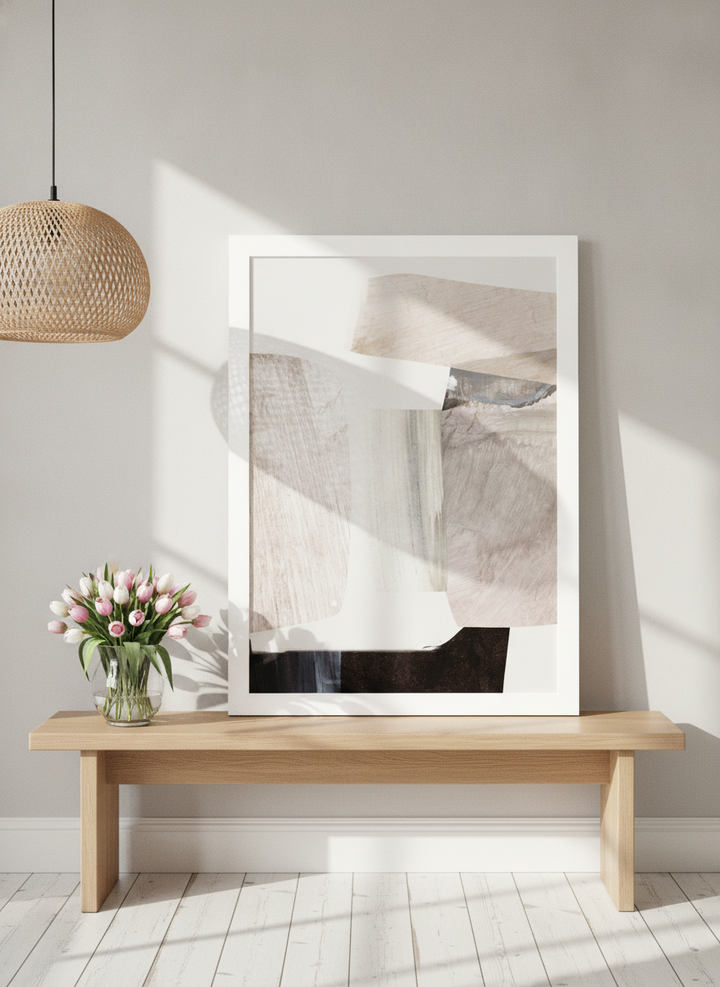 Modern wall art print standing on a bench in a bright Scandinavian home office