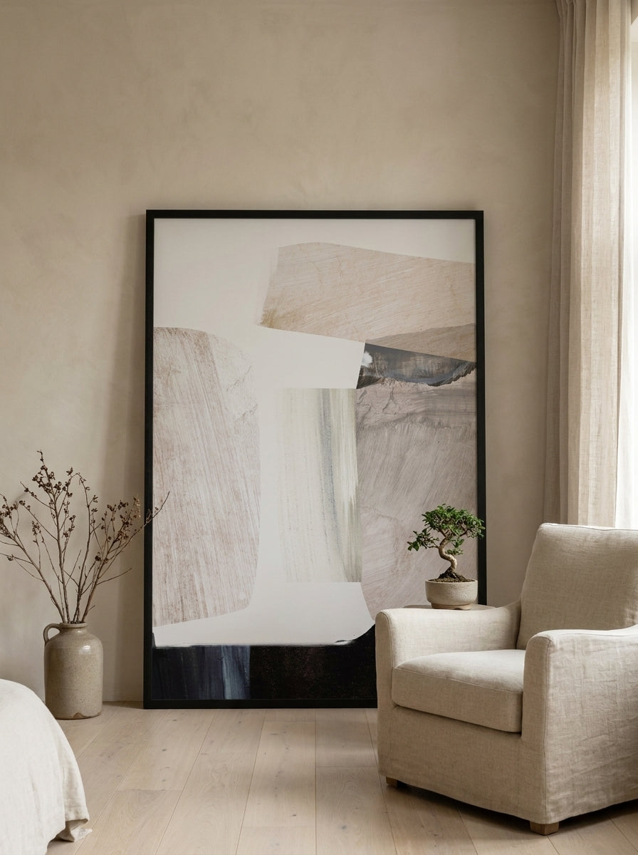 Oversized statement modern wall art print leaning against the wall in a warm Japandi bedroom