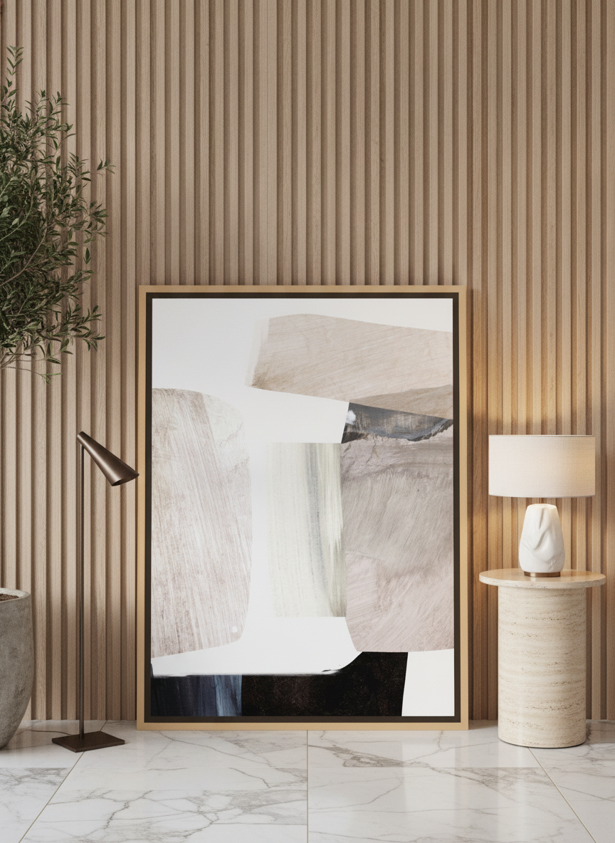 Oversized statement canvas wall art with a natural timber surround leaning against the wall in a luxe living room