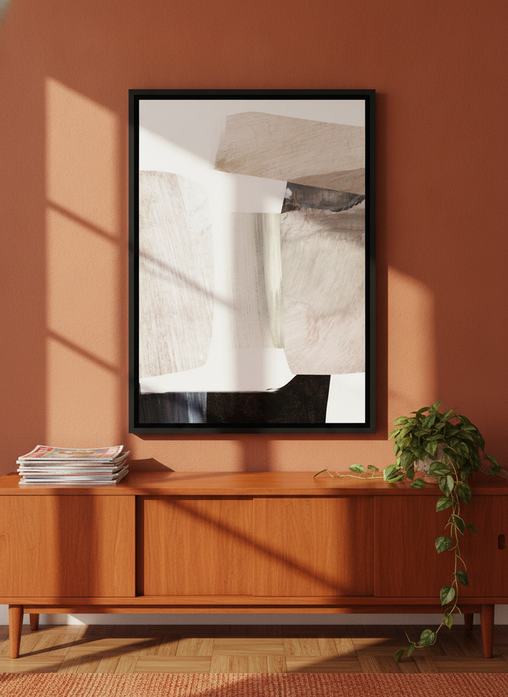 Canvas wall art with a black surround standing on a sideboard in a retro 70s living room