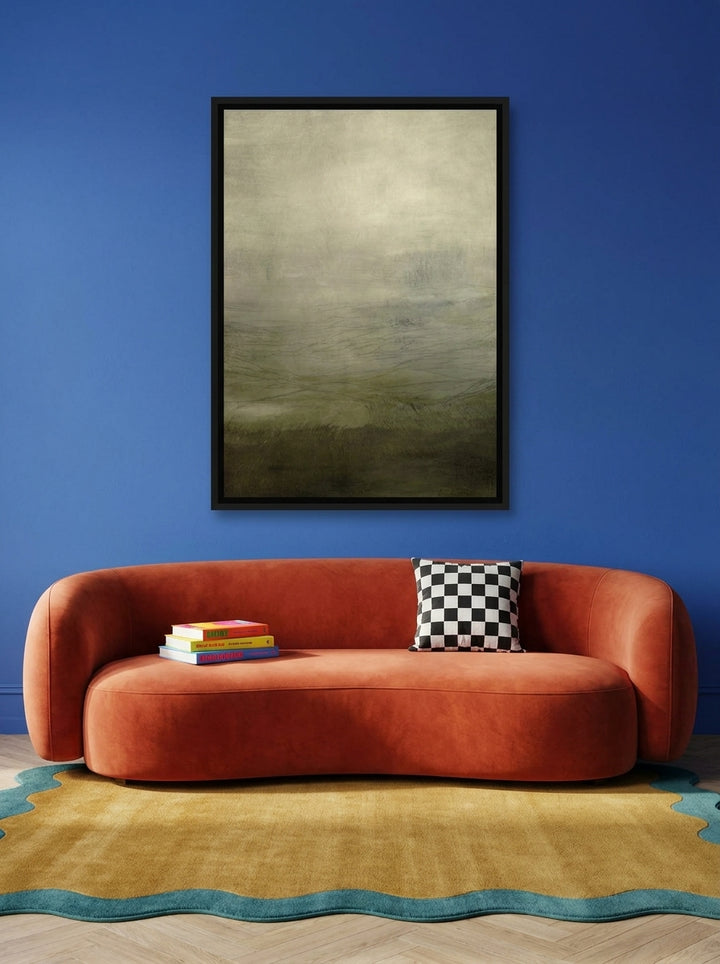 Canvas wall art with a black surround styled on the wall in a colourful eclectic living room