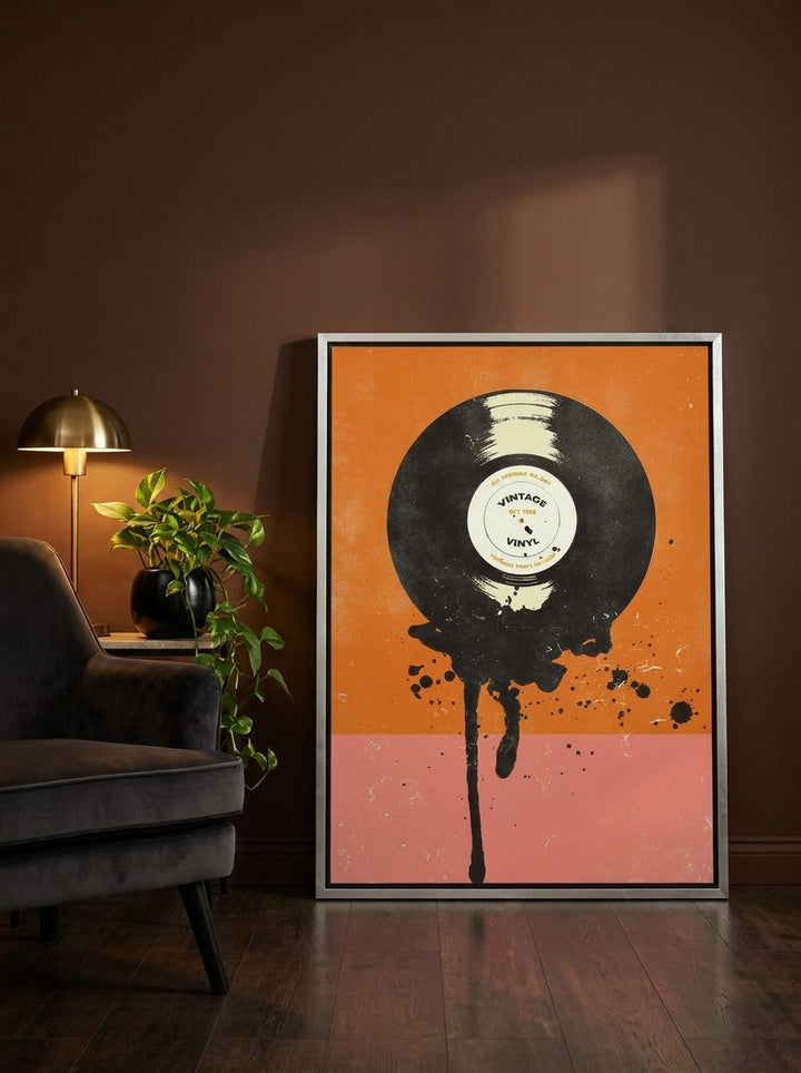 Canvas wall art with a silver leaf surround leaning against the wall in a moody home office