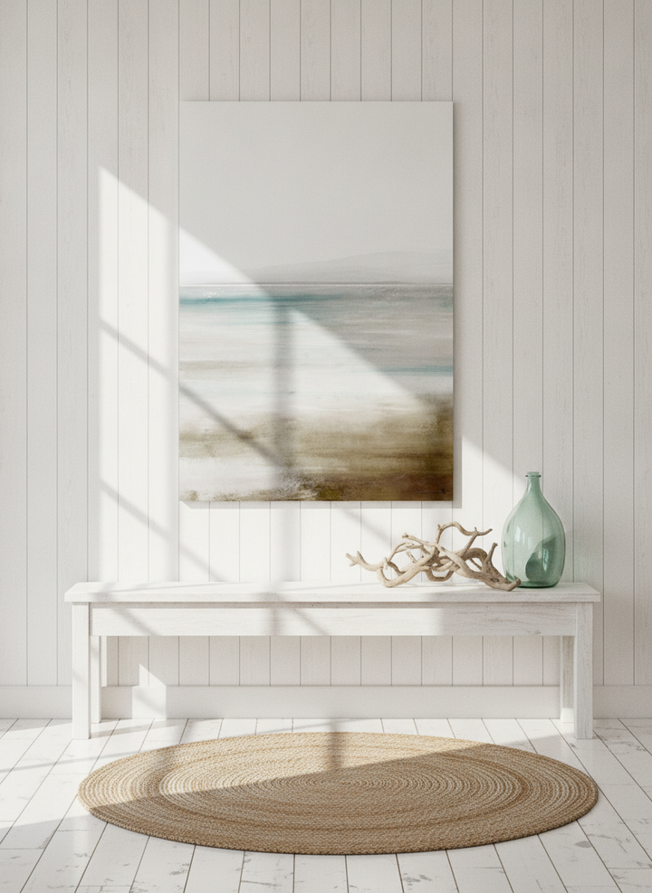 Stretched canvas wall art styled on the wall in a coastal living room