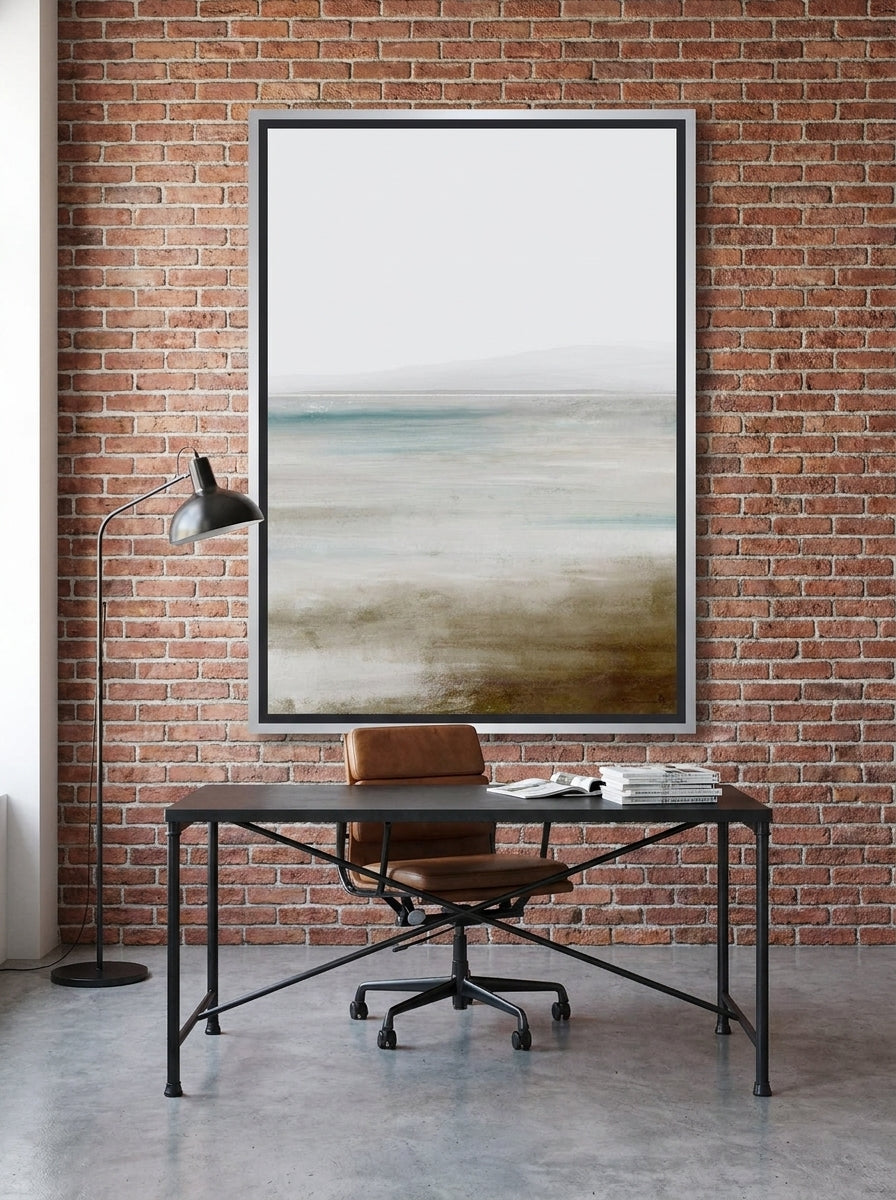 Canvas wall art with a silver leaf surround styled on the wall in an industrial loft home office