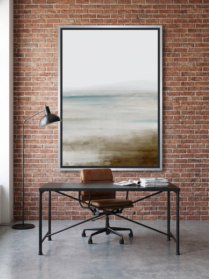 Canvas wall art with a silver leaf surround styled on the wall in an industrial loft home office