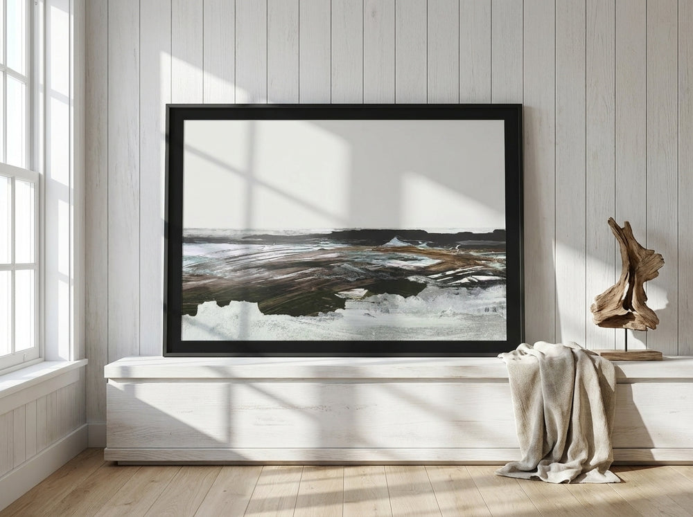 Modern wall art print standing on a console in a coastal home office