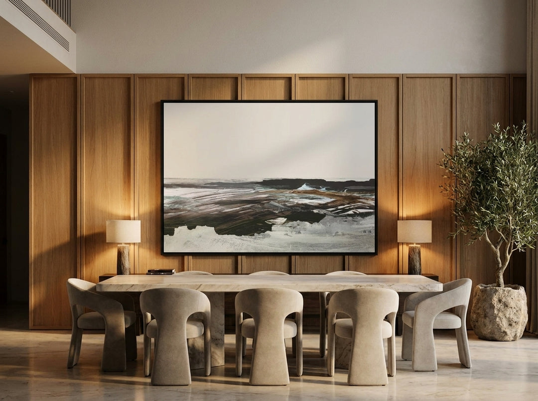 Oversized statement canvas wall art with a black surround styled on the wall in a luxe dining room