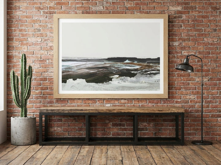 Modern wall art print styled on the wall in an industrial loft living room