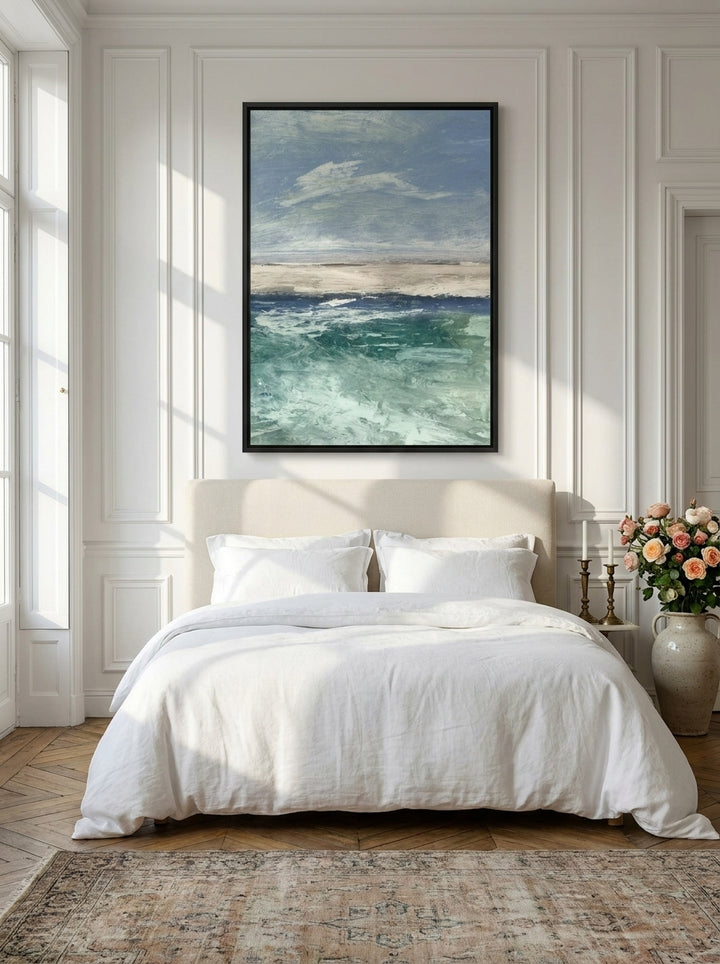Canvas wall art with a black surround styled on the wall in a Parisian bedroom