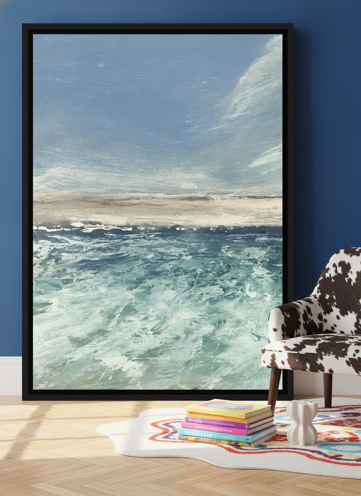 Canvas wall art with a black surround leaning against the wall in a colourful eclectic home office