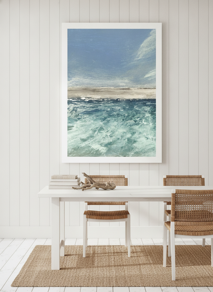 Modern wall art print styled on the wall in a coastal dining room