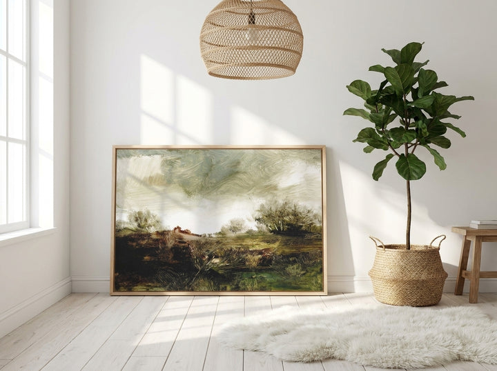 Canvas wall art with a natural timber surround leaning against the wall in a bright Scandinavian bedroom
