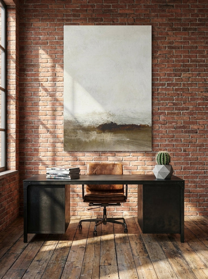 Stretched canvas wall art styled on the wall in an industrial loft home office