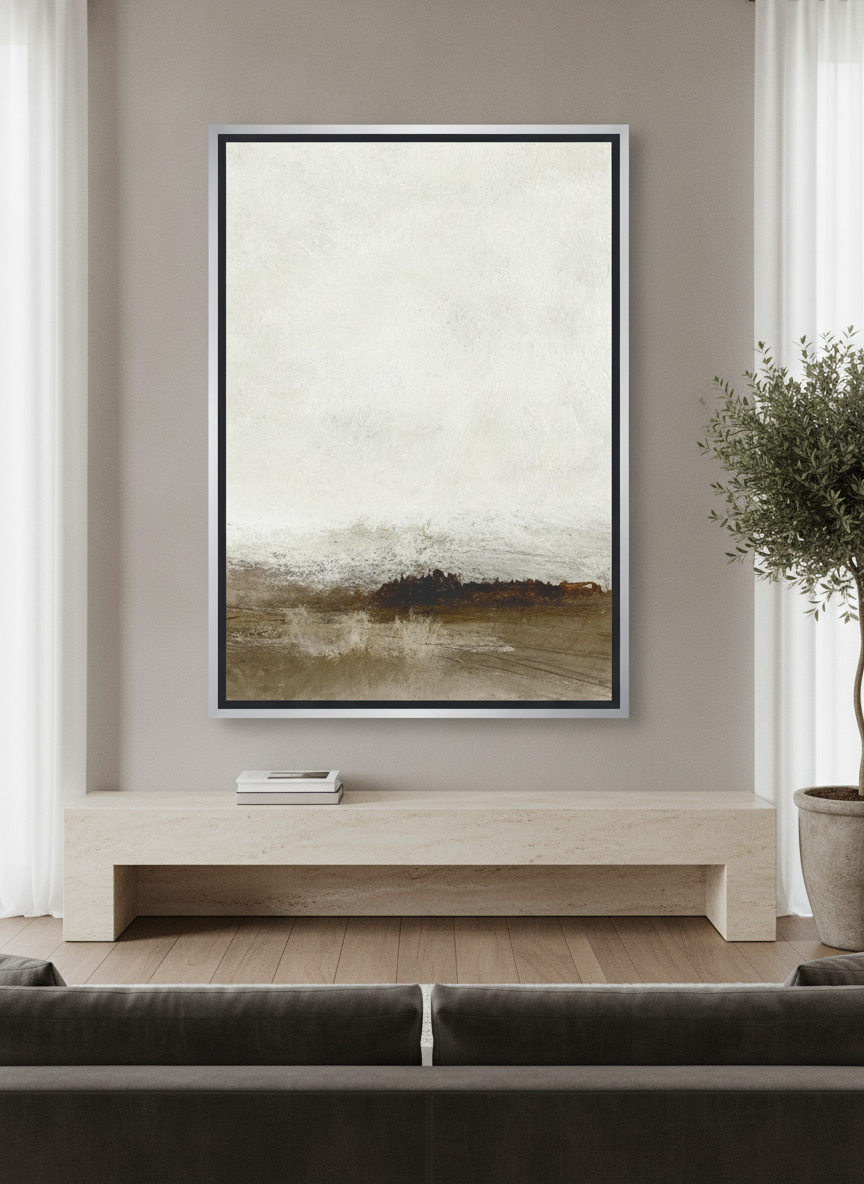 Oversized statement canvas wall art with a silver leaf surround styled on the wall in a luxe living room