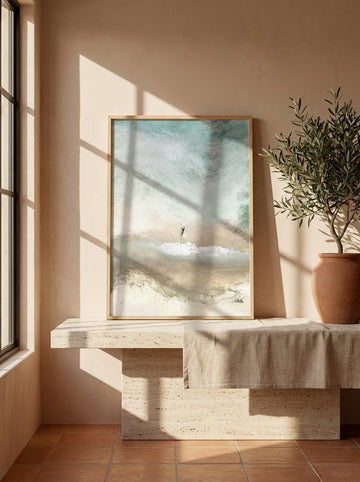 Modern wall art print standing on a console in a Mediterranean home office