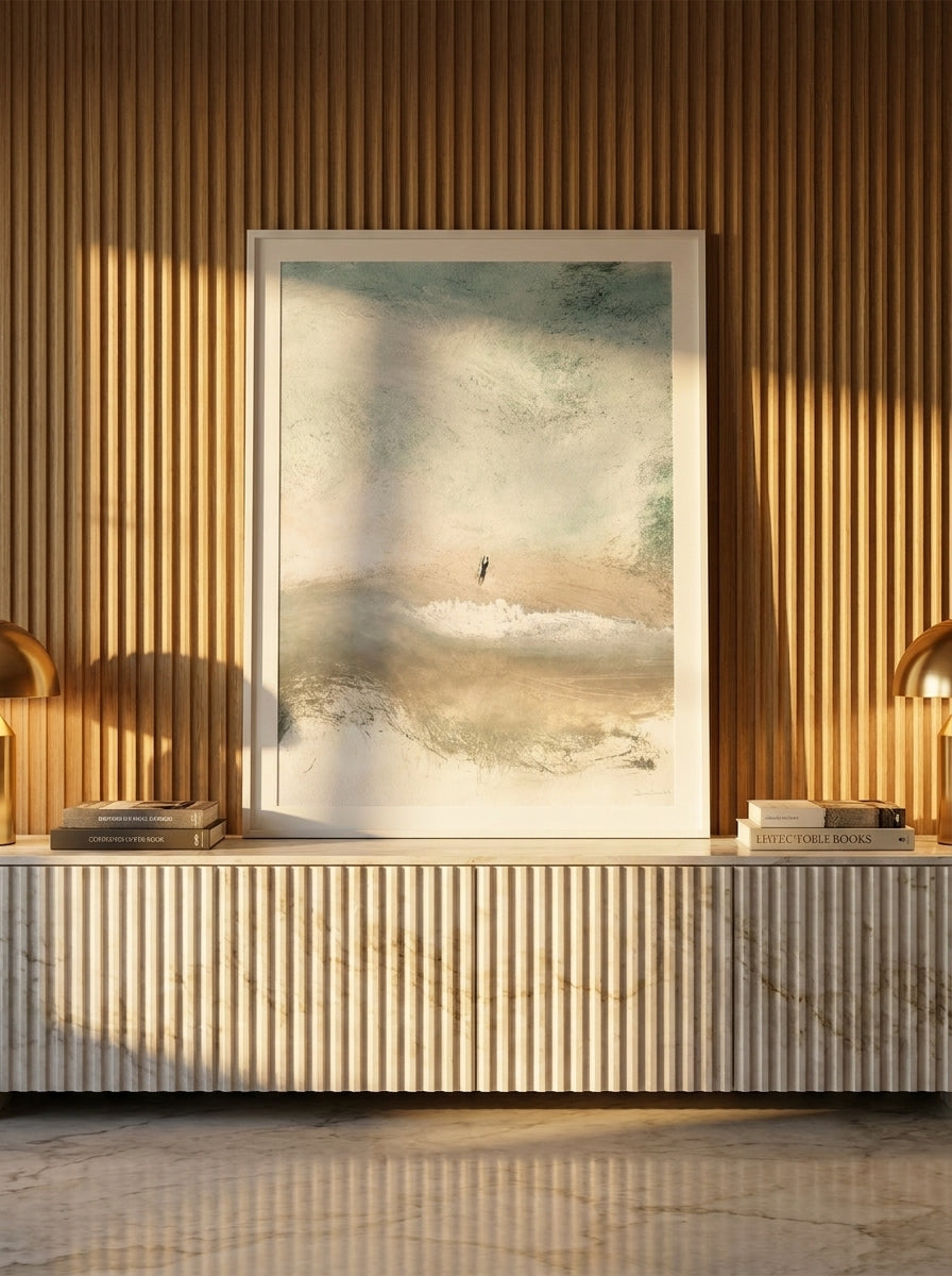 Modern wall art print standing on a sideboard in a luxe living room