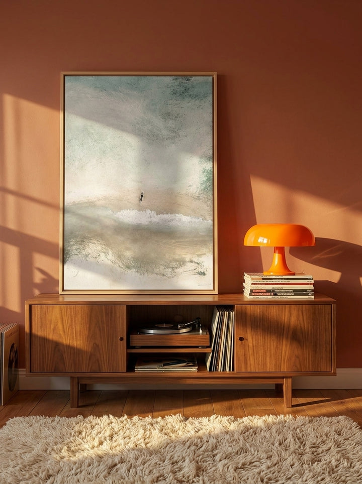 Canvas wall art with a natural timber surround standing on a sideboard in a retro 70s home office