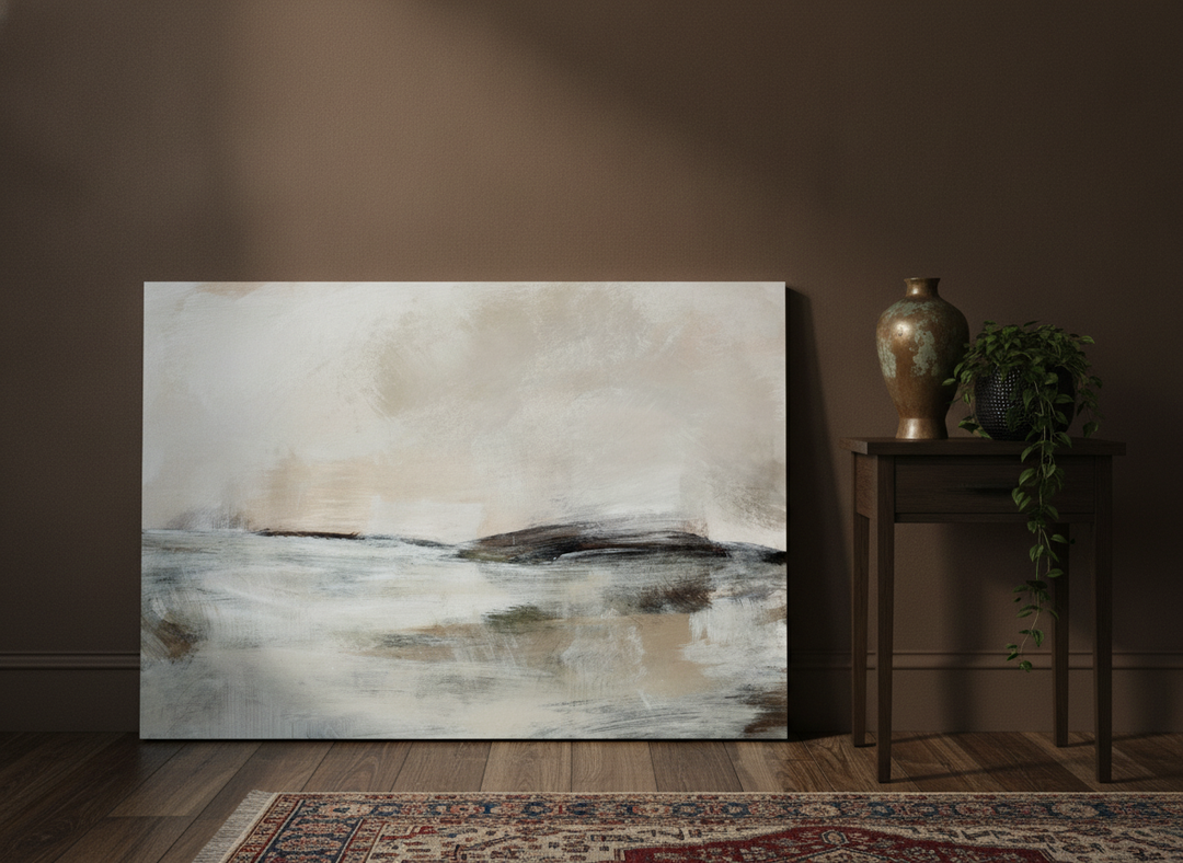 Stretched canvas wall art leaning against the wall in a moody bedroom