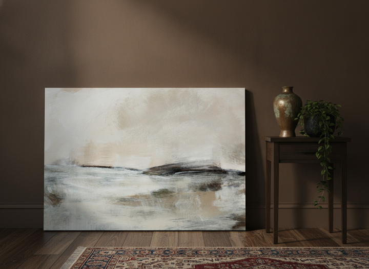 Stretched canvas wall art leaning against the wall in a moody bedroom