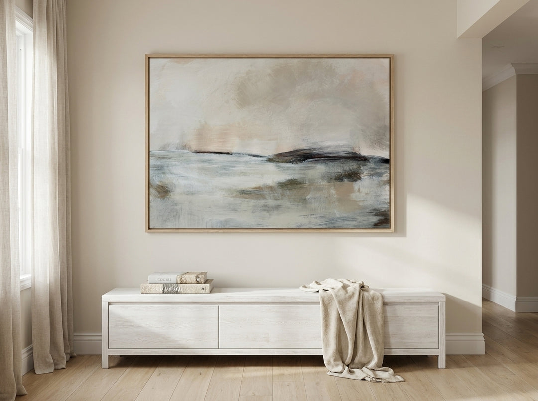 Oversized statement modern wall art print styled on the wall in a coastal living room