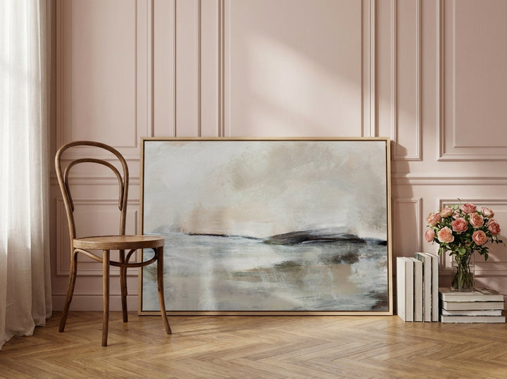 Canvas wall art with a natural timber surround leaning against the wall in a Parisian home office