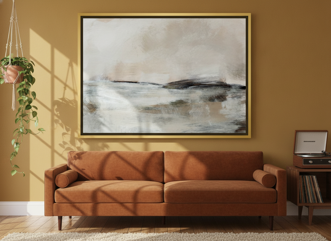 Oversized statement canvas wall art with a gold leaf surround styled on the wall in a retro 70s living room