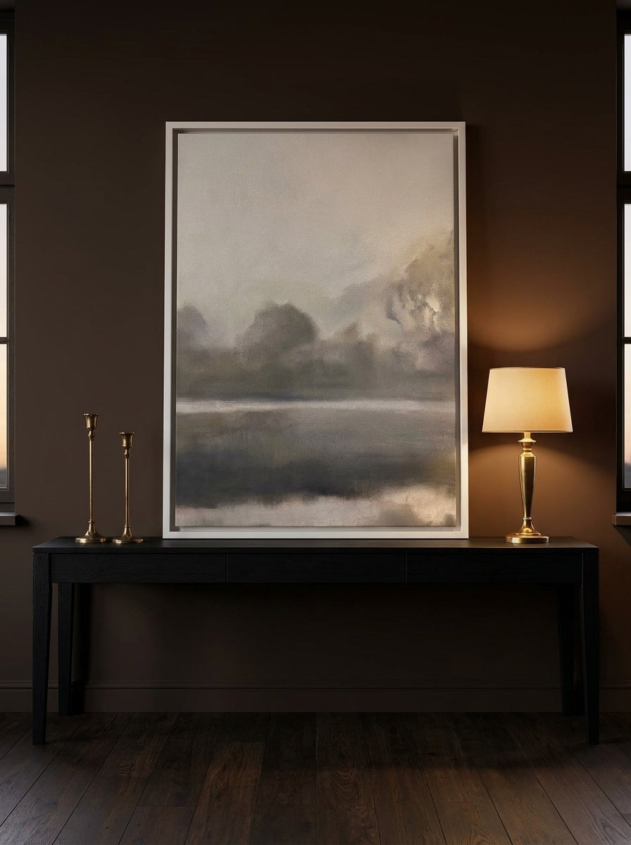 Canvas wall art with a white surround standing on a console in a moody bedroom