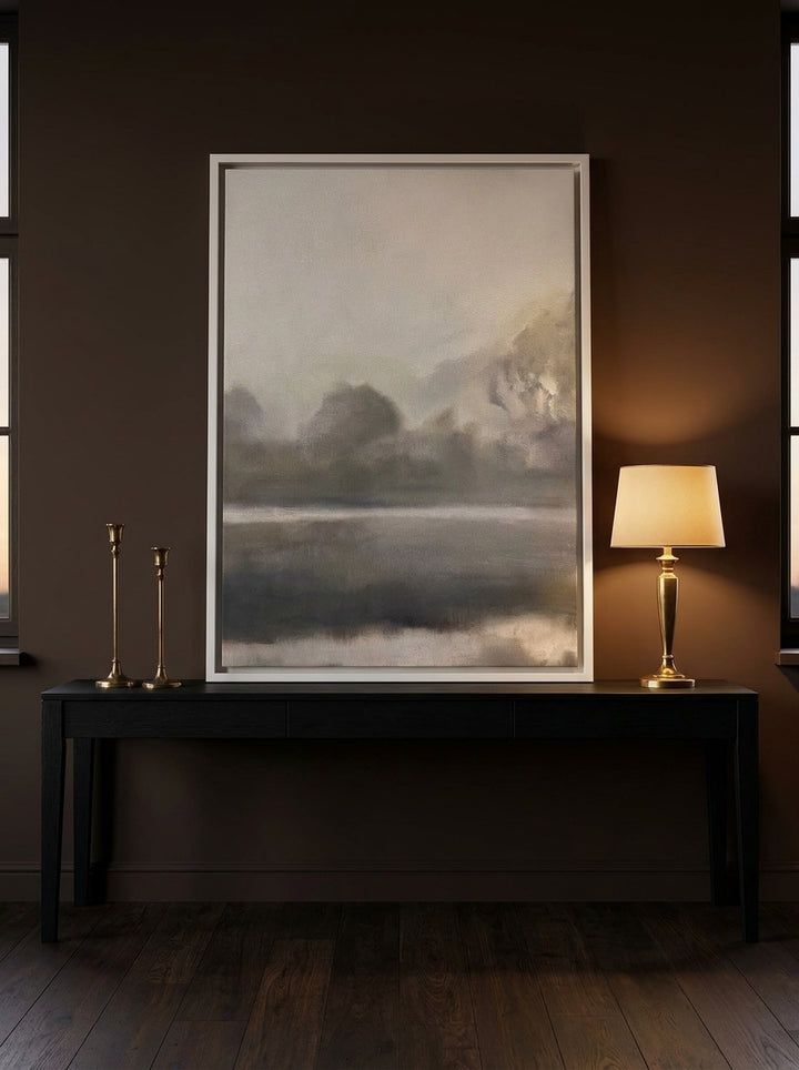 Canvas wall art with a white surround standing on a console in a moody bedroom