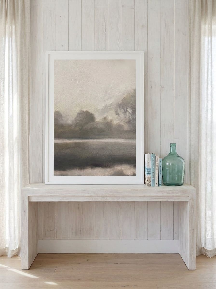 Modern wall art print standing on a console in a coastal home office