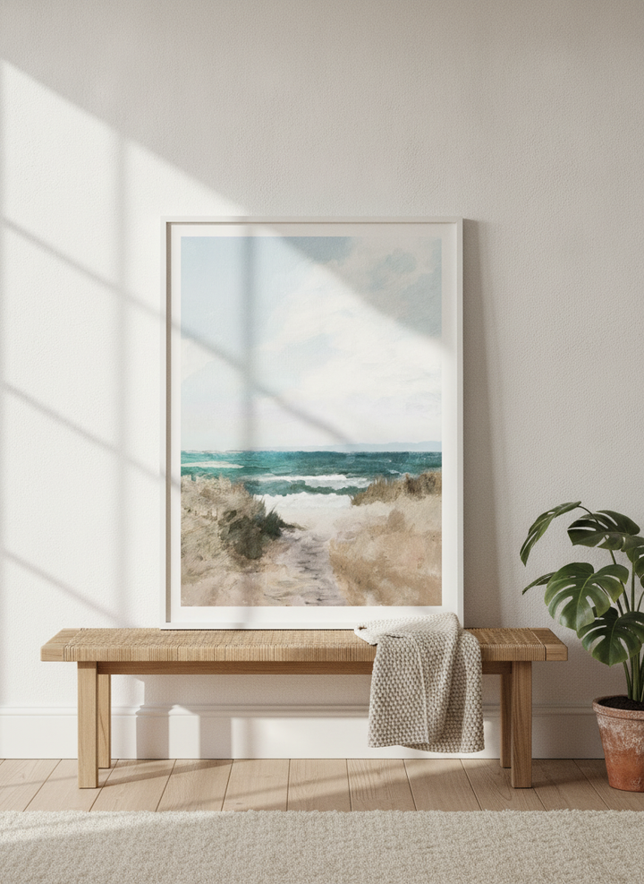 Modern wall art print standing on a bench in a bright Scandinavian bedroom