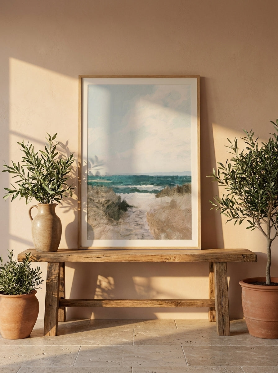 Modern wall art print standing on a bench in a Mediterranean bathroom
