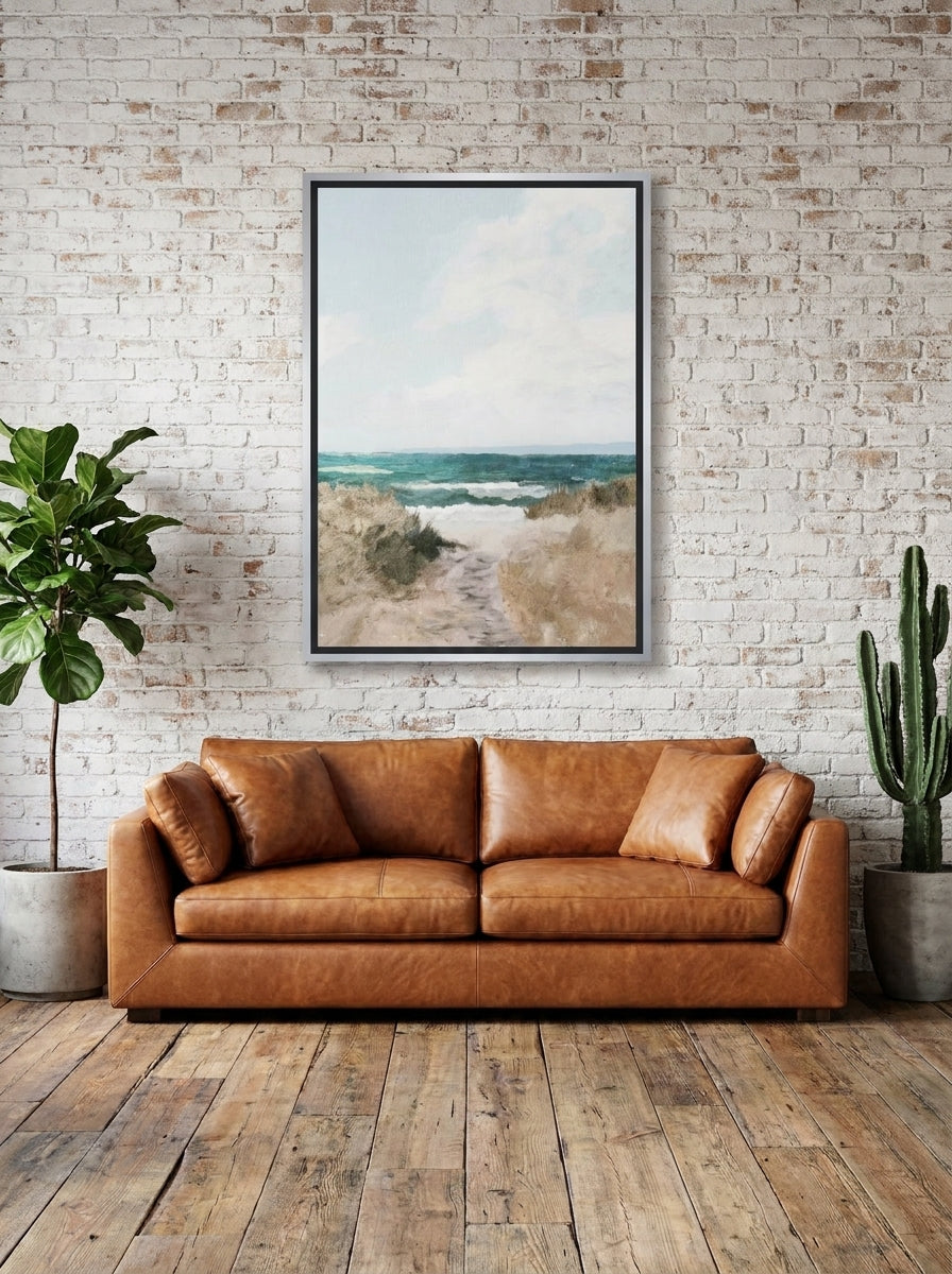 Canvas wall art with a silver leaf surround styled on the wall in an industrial loft living room
