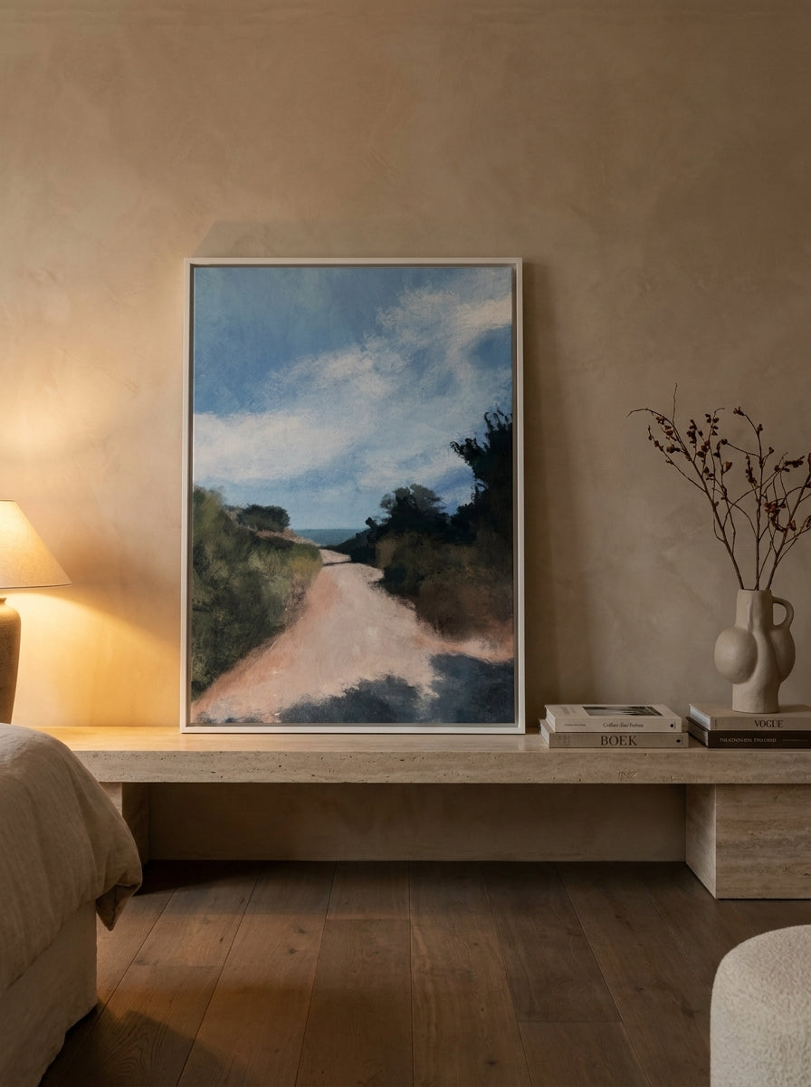 Canvas wall art with a white surround standing on a console in a luxe bedroom