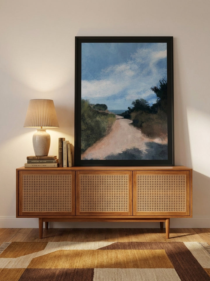 Modern wall art print standing on a sideboard in a mid-century living room