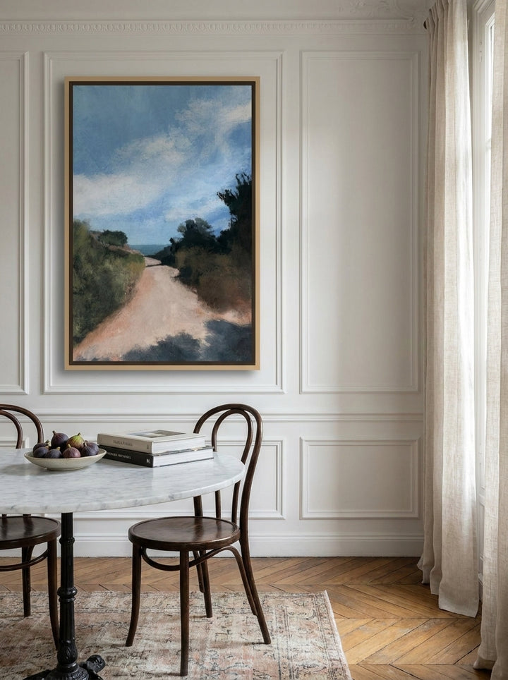 Oversized statement canvas wall art with a natural timber surround styled on the wall in a Parisian dining room