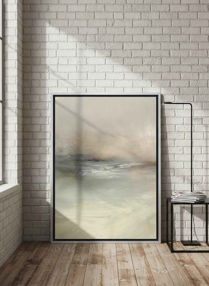 Canvas wall art with a silver leaf surround leaning against the wall in an industrial loft bedroom