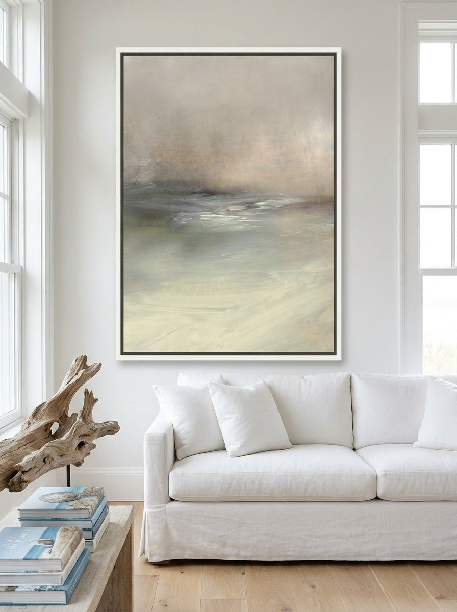 Oversized statement canvas wall art with a white surround styled on the wall in a coastal living room