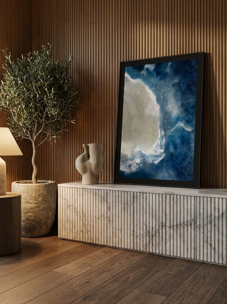 Modern wall art print standing on a sideboard in a luxe bathroom