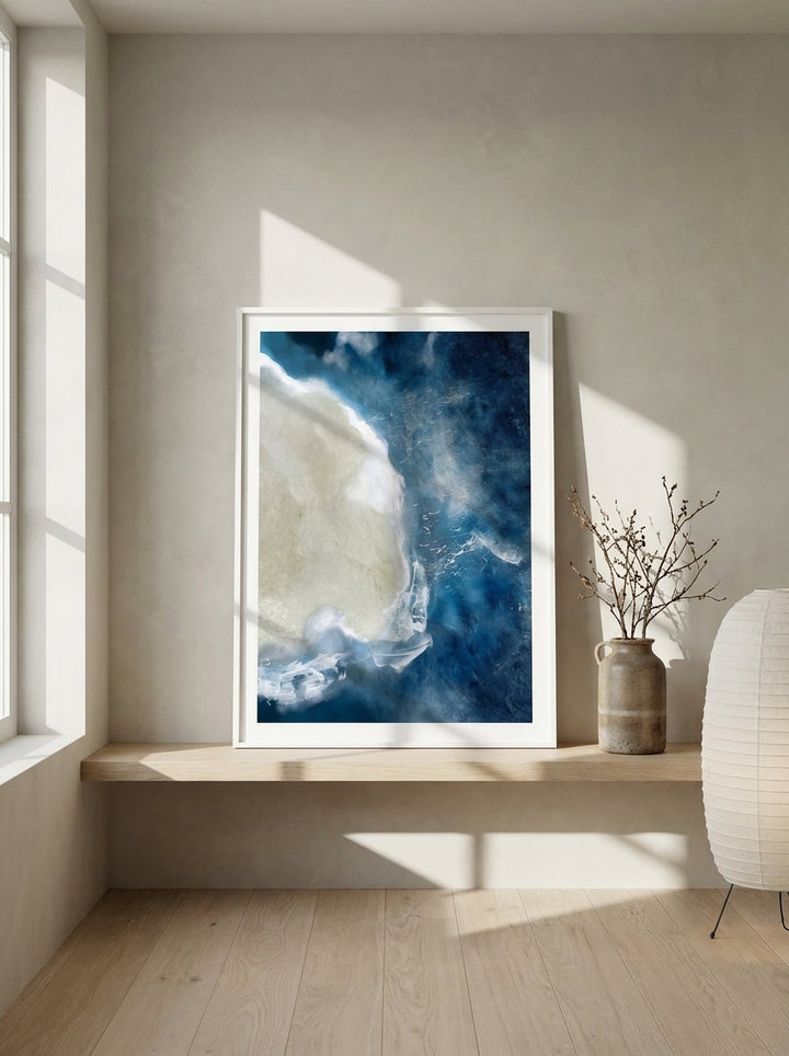 Modern wall art print standing on a shelf in a warm Japandi bedroom